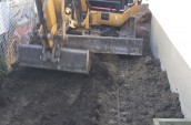A worker with a excavator is operating for the levelled the ground