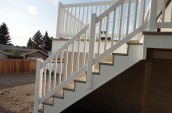 White outdoor staircases is installed with white handrails