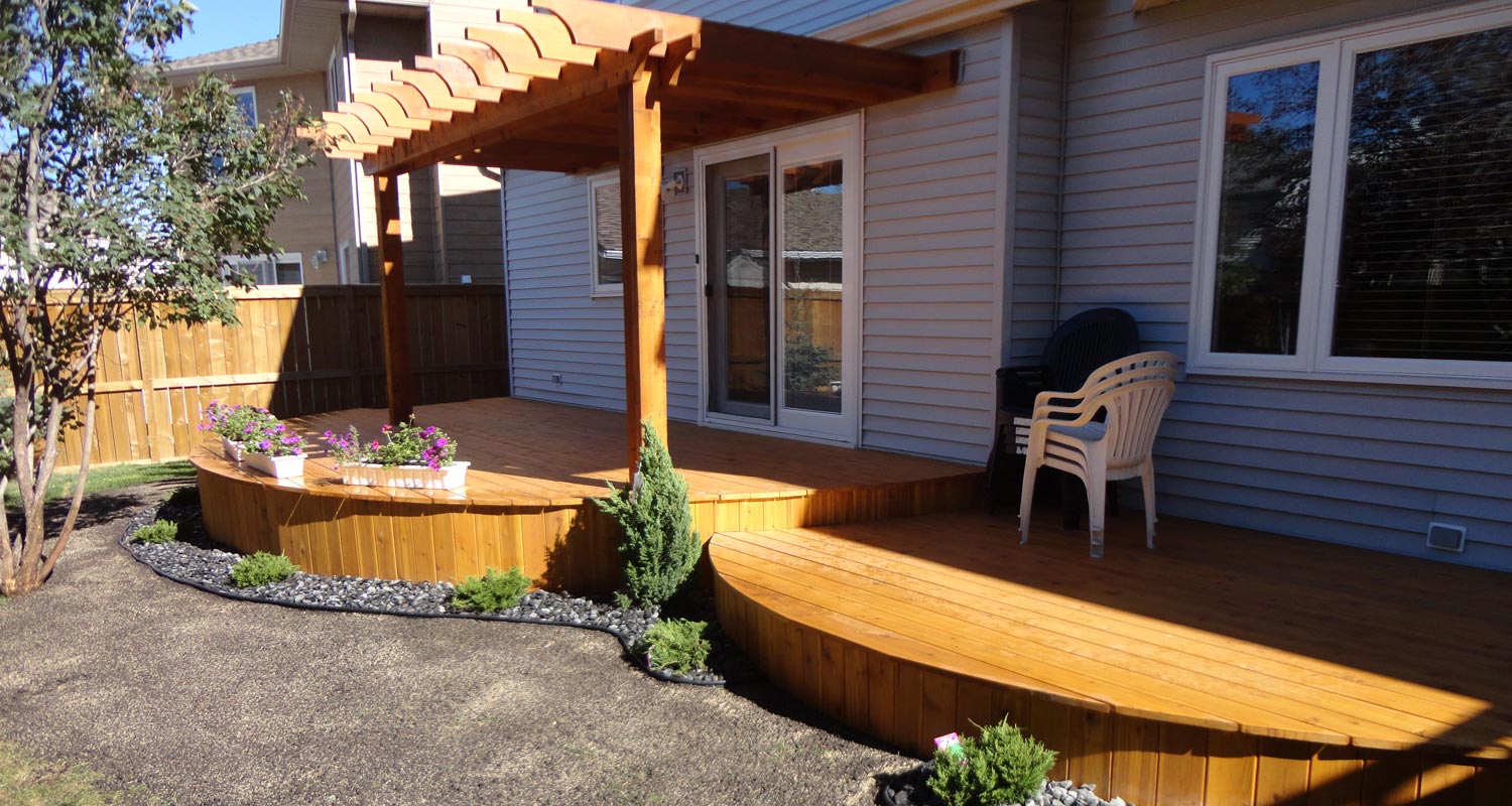 Modern Patio wooden deck with minimal garden in grey stones