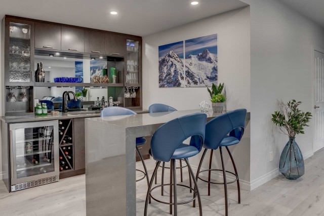 stacked bar with four barstools at a counter