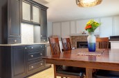 wooden table with large floral centrepiece