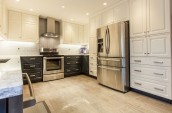 kitchen with wooden floor, oven with extractor and fridge/freezer
