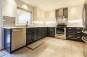 kitchen with wooden floor, oven with extractor and fridge/freezer