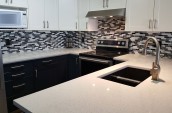 kitchen showing sink, oven and microwave