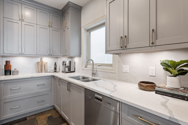 double sink in kitchen with coffee maker in corner