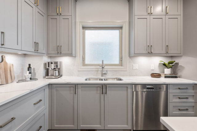 double sink in kitchen with dishwasher to the right