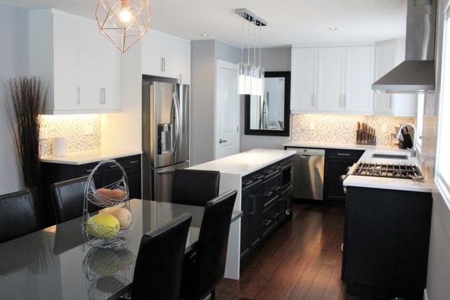 six seater dinner table with kitchenette in background