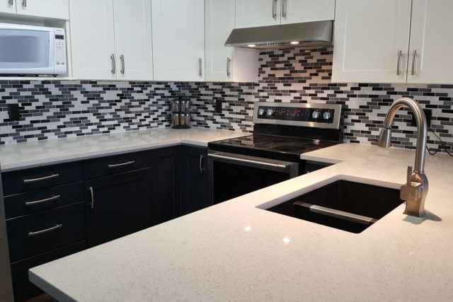 kitchen showing sink, oven and microwave